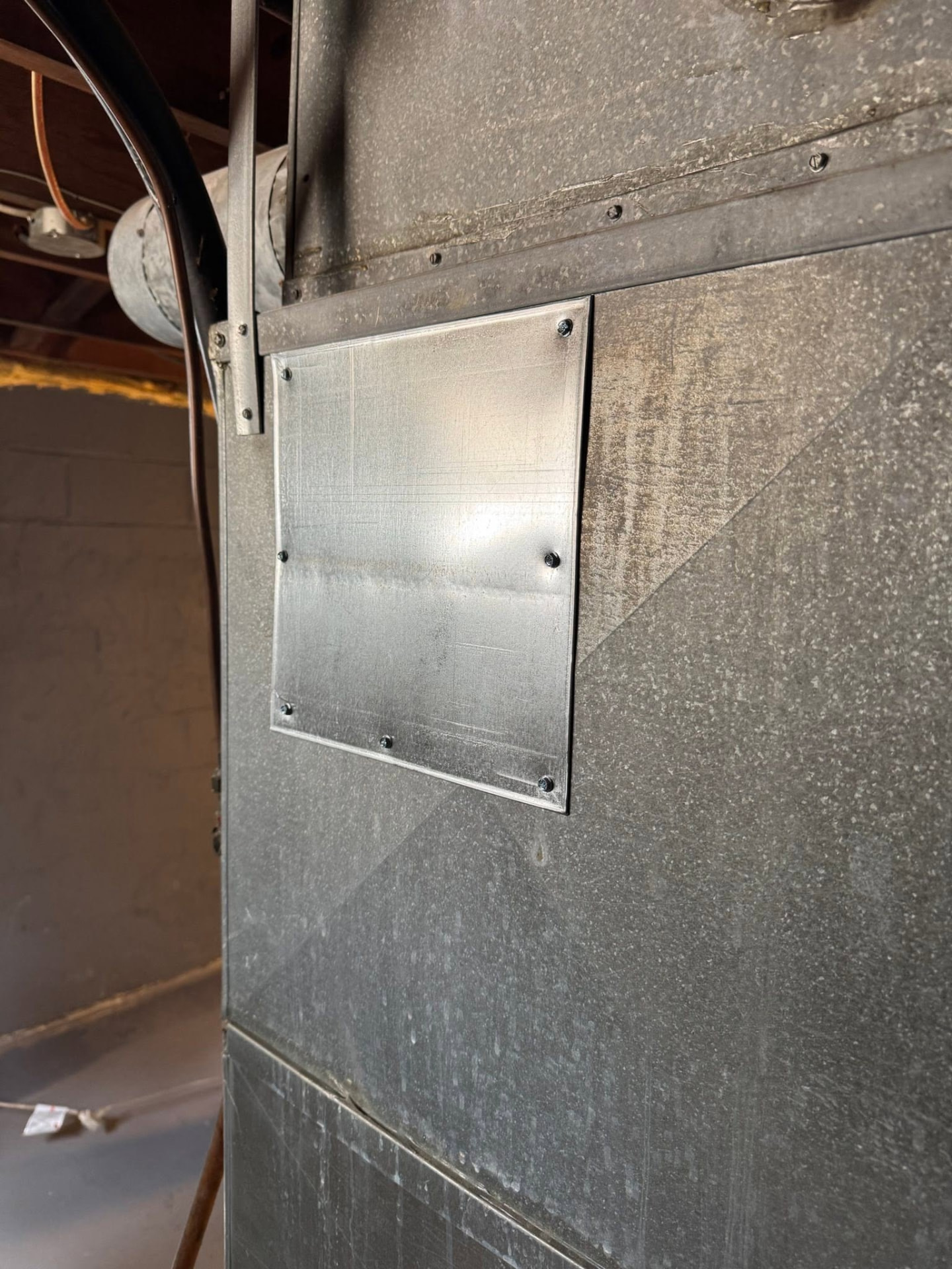 Permanent sheet-metal access panel installed and secured