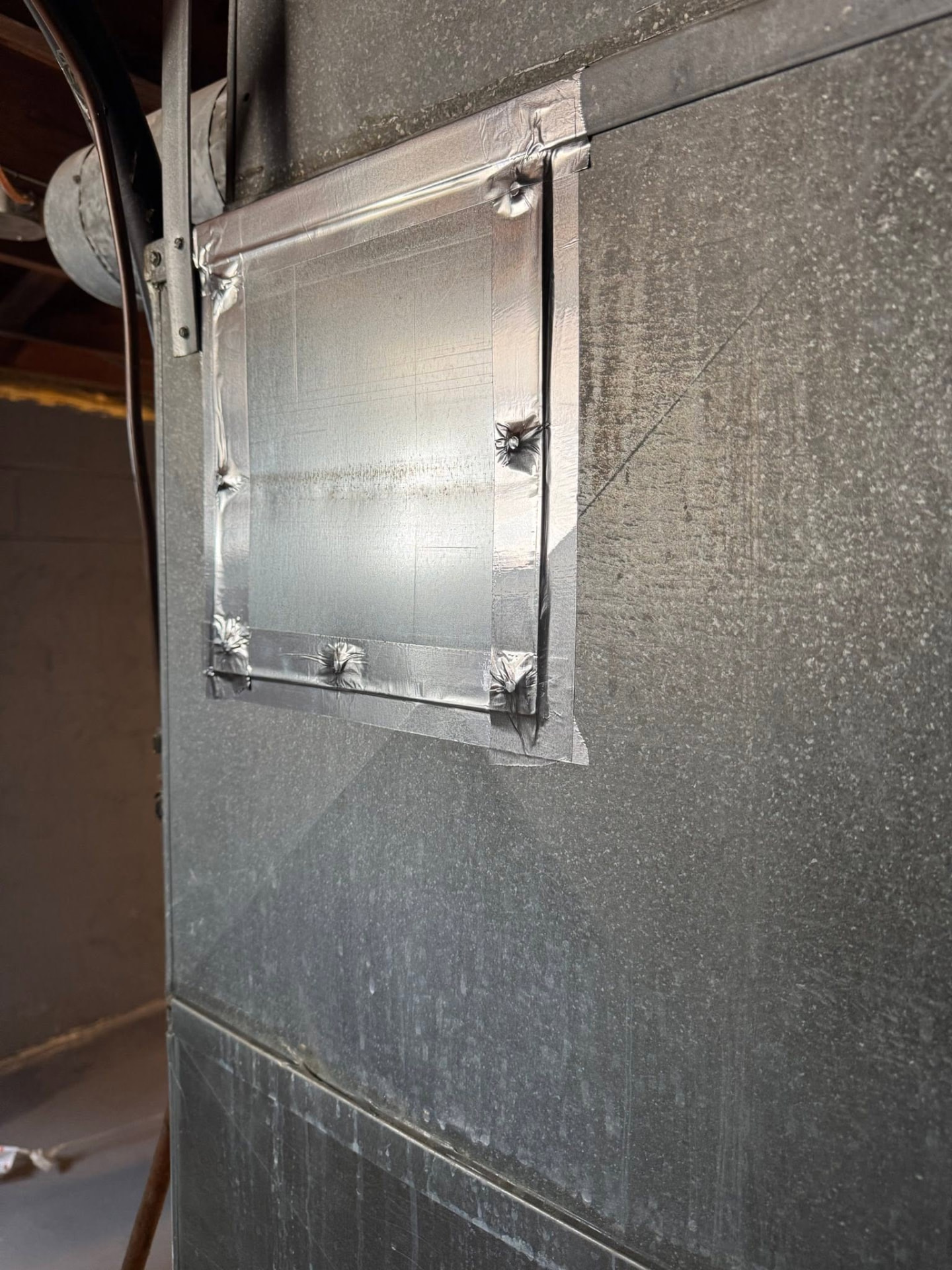 Access port sealed with foil tape after cleaning