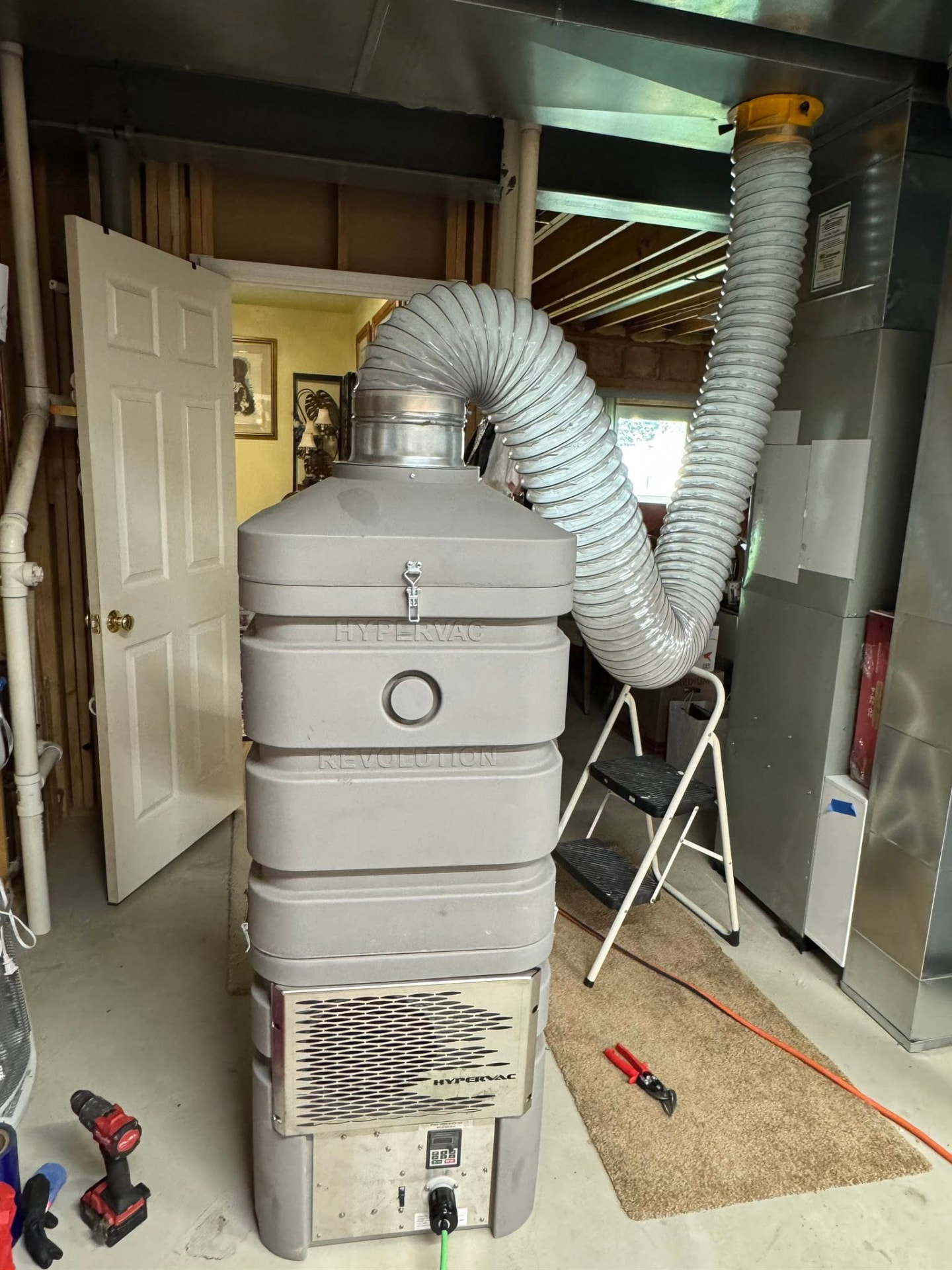 HyperVac Revolution negative-air vacuum connected to the main trunk line